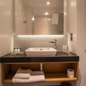 Guest bathroom with shower and free toiletries at Holiday Inn Leicester-Wigston.