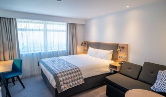 Day use room with work desk and lounge area at Holiday Inn Leicester-Wigston.