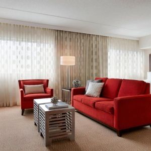 Day use room with sofa and work desk at Renaissance Newark Airport Hotel.