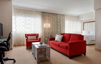 Day use room with sofa and work desk at Renaissance Newark Airport Hotel.