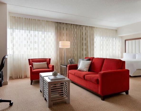 Day use room with sofa and work desk at Renaissance Newark Airport Hotel.