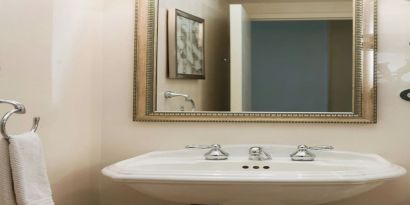 Guest bathroom with shower at Renaissance Newark Airport Hotel.