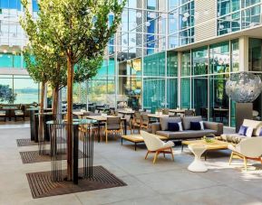 Al fresco dining with ample seats at AC Hotel By Marriott SFO/Oyster Point Waterfront.