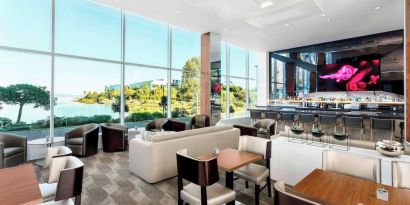 Lounge and coworking area at AC Hotel By Marriott SFO/Oyster Point Waterfront.