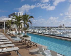 Refreshing outdoor pool with a view of the ocean at The Ben, Autograph Collection.