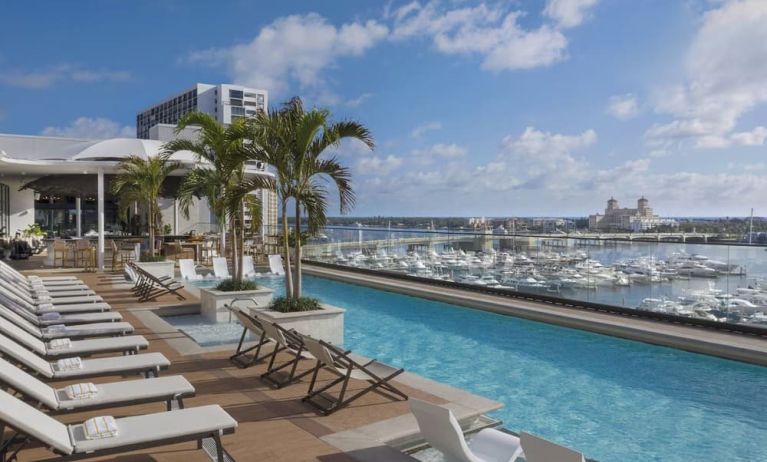 Refreshing outdoor pool with a view of the ocean at The Ben, Autograph Collection.