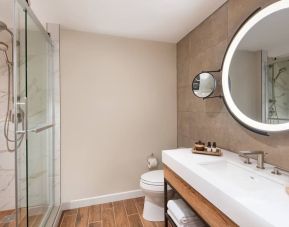 Guest bathroom with shower at The Ben, Autograph Collection.