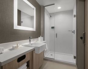 Guest bathroom with shower at SpringHill Suites Tuckahoe.