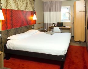 Standard day use room with king bed and work desk at ibis Leicester City.