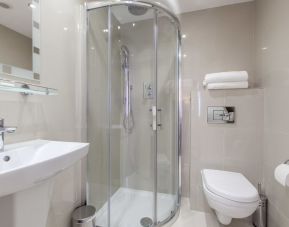 Private bathroom with shower and free toiletries at Hotel Shepherds Bush London.