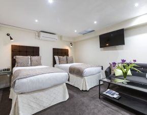 Day use family suite with two beds and lounge area at Hotel Shepherds Bush London.