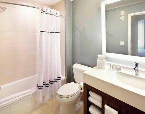 Guest bathroom with shower and tub at Residence Inn Secaucus.