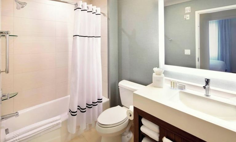 Guest bathroom with shower and tub at Residence Inn Secaucus.