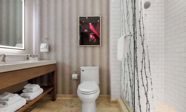 Guest bathroom with shower at Cambria Hotel Nashville Downtown.