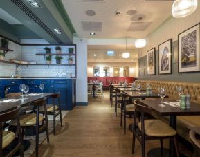 Hotel restaurant with comfortable seating at Indigo London-Paddington Hotel.