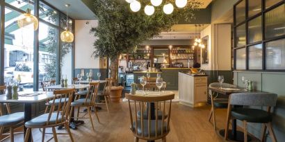 Dining area at Indigo London-Paddington Hotel.