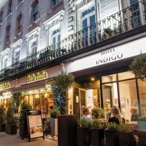 Outdoor seating area at Indigo London-Paddington Hotel.