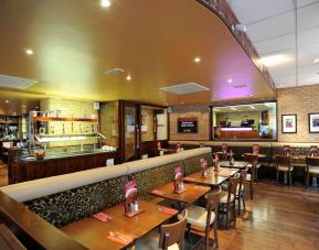 Dining area with comfortable seating at Mercure London Paddington Hotel.