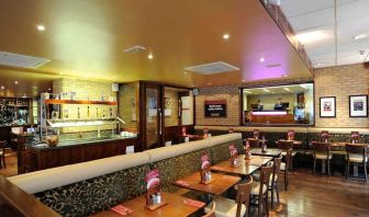 Dining area with comfortable seating at Mercure London Paddington Hotel.