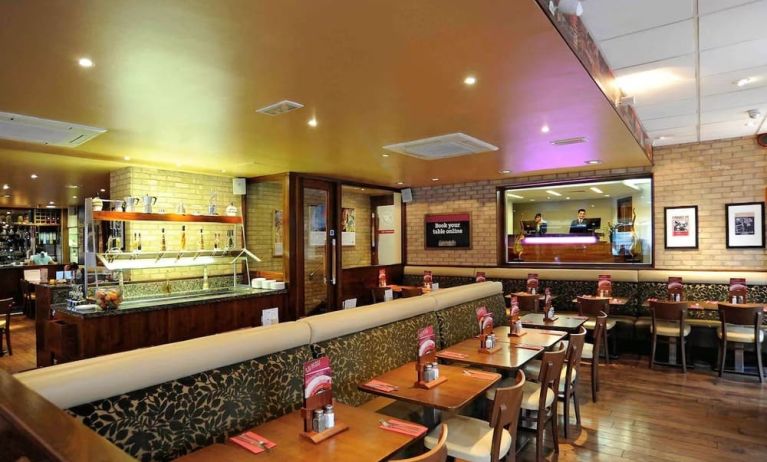 Dining area with comfortable seating at Mercure London Paddington Hotel.