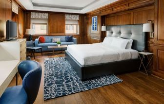 Day room with sofa and work desk at Hampton Inn Washington DC / White House.