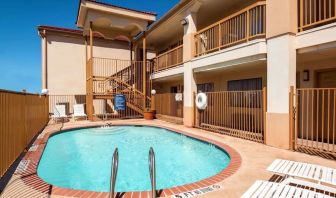 Refreshing outdoor pool at Days Inn By Wyndham San Antonio Northwest/Seaworld.