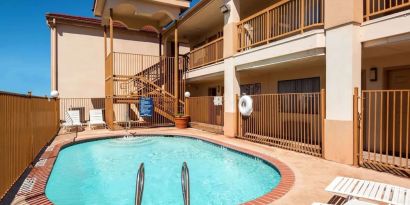 Refreshing outdoor pool at Days Inn By Wyndham San Antonio Northwest/Seaworld.