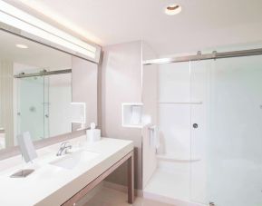 Guest bathroom with shower at Courtyard By Marriott Redwood City.