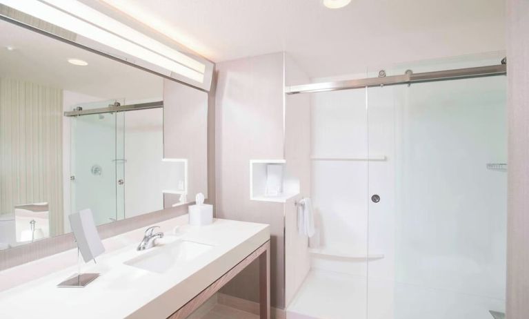 Guest bathroom with shower at Courtyard By Marriott Redwood City.