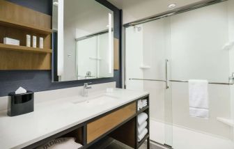 Guest bathroom with shower at Hilton Garden Inn Sunnyvale.