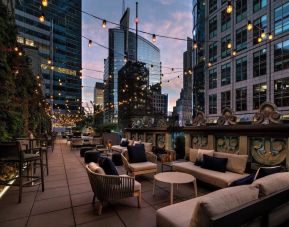 Rooftop terrace seating at The Knickerbocker Hotel.