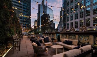 Rooftop terrace seating at The Knickerbocker Hotel.