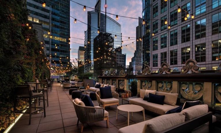 Rooftop terrace seating at The Knickerbocker Hotel.