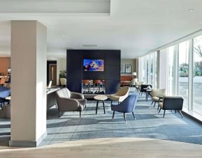 Bright and comfortable lobby lounge at Hyatt Place London Heathrow Airport.