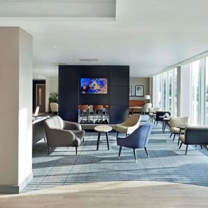 Bright and comfortable lobby lounge at Hyatt Place London Heathrow Airport.