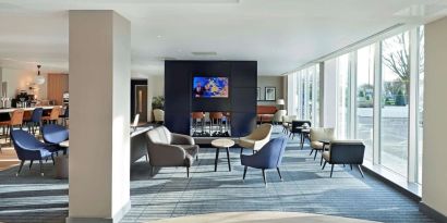 Bright and comfortable lobby lounge at Hyatt Place London Heathrow Airport.