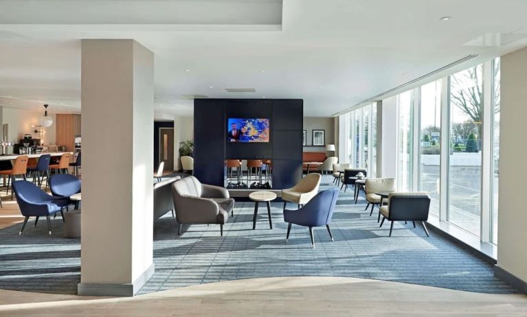 Bright and comfortable lobby lounge at Hyatt Place London Heathrow Airport.