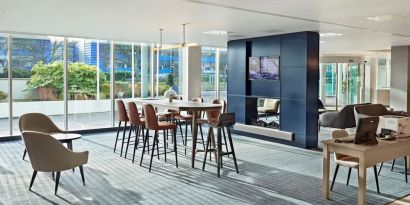 Lobby workspace with computer and printer at Hyatt Place London Heathrow Airport.