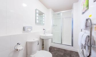 Guest bathroom with shower and free toiletries at Mercure Nottingham City Centre Hotel.