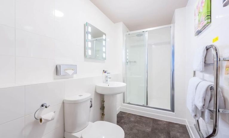 Guest bathroom with shower and free toiletries at Mercure Nottingham City Centre Hotel.