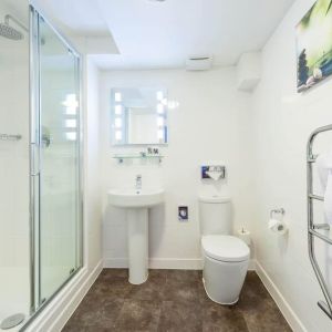 Guest bathroom with shower at Mercure Nottingham City Centre Hotel.