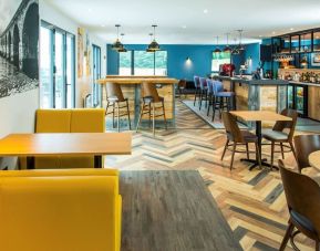 Dining area with comfortable seating, perfect for co-working at Ibis Plymouth.