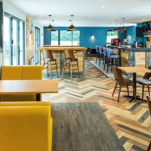 Dining area with comfortable seating, perfect for co-working at Ibis Plymouth.