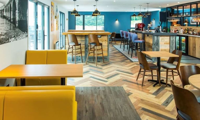 Dining area with comfortable seating, perfect for co-working at Ibis Plymouth.