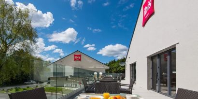 Hotel terrace with sitting area at Ibis Plymouth.