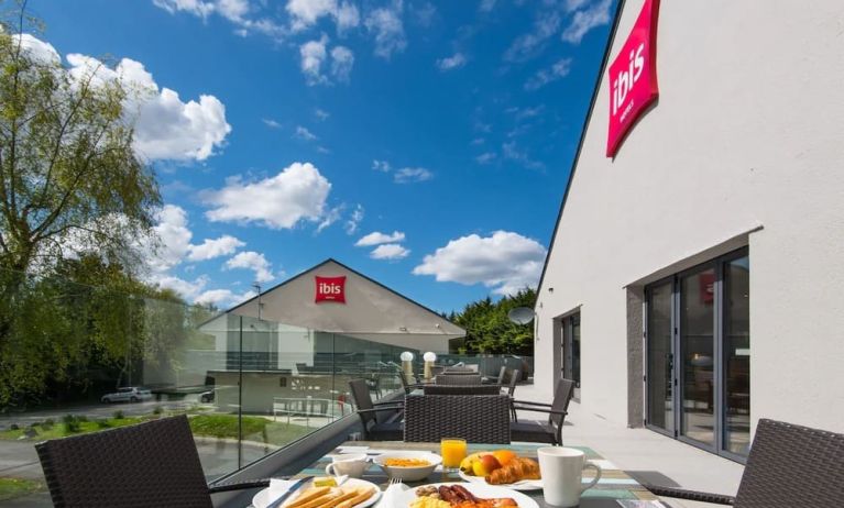 Hotel terrace with sitting area at Ibis Plymouth.