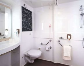 Guest bathroom with shower at Ibis Plymouth.