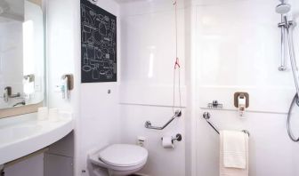 Guest bathroom with shower at Ibis Plymouth.