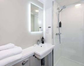 Private guest bathroom with shower at Ibis Plymouth.