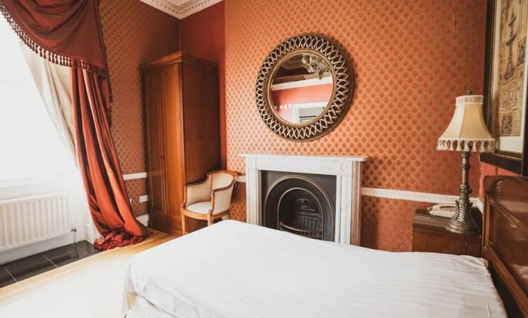 Bright and spacious day use room with fireplace at Opulence Central London Hotel.